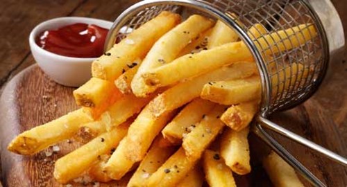Mccain french fries on wooden serving board